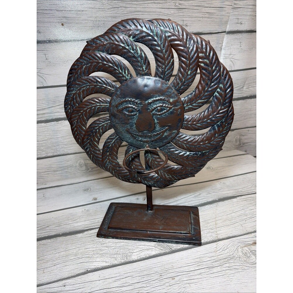 Rustic Metal Sun Art Sculpture Featuring A Detailed Face Votive Candle Holder?